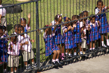 School kids wave at St. Kitts train