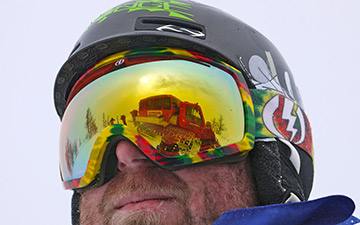 Castle Mountain cat skiing reflected in goggles