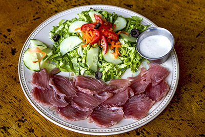 Yellowfin tuna sasami, fresh raw fish served with a green salad. Photo by Yvette Cardozo