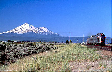 Train passing Mount Shasta