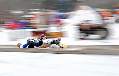 Maine winter festival toboggan racers