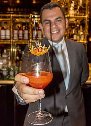 Presenting finished Bellini Rosso drink