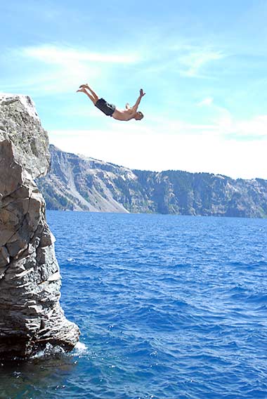 Lee Juillerat swan dives into Crater Lake