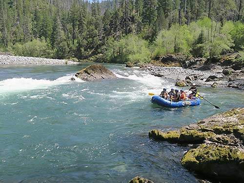 Illinois River rafting aiming through an easy rapid