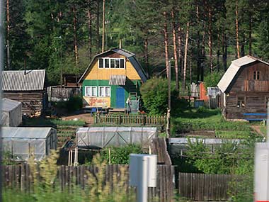 Trans-Siberian Railway view of homes and gardens