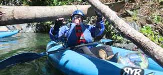 Klamath Basin Clear Creek rafting, doing the limbo under a lot