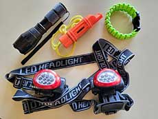 Emergency go-bag: flashlight, whistle, rope