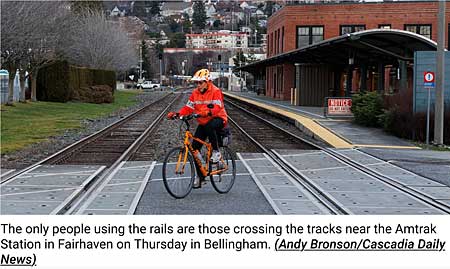 Author on bike crossing RR tracks