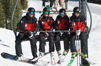 Snow Angel patrollers on a chairlift