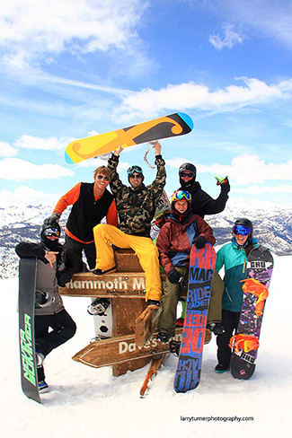 Mammoth snowboarders posing on top