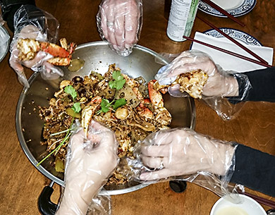 Digging into spicy crab bowl at Shun Spicy Crab