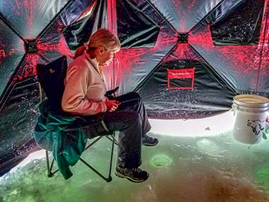 Ice fishing in a tent