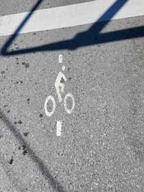 Cyclist street graphic to change traffice signal
