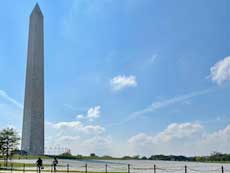 The Washington Monument rises into a clear sky