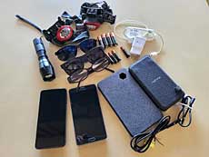 Emergency go-bag, phone, charger, glasses, batteries