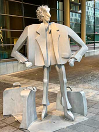 Whimsical sculpture of a traveler in Oslo, Norway