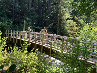McKenzie River, Oregon, hikers on a sturdy bridge