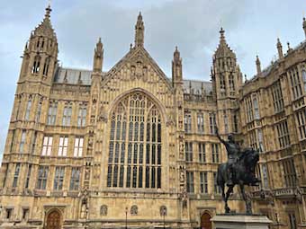 The exterior of Westminster Palace with the statue of Richard the Lionheart