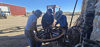 Mike Hanley seting a wagon wheel