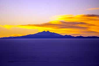 Bolivia, sunset with mountain and salt flat